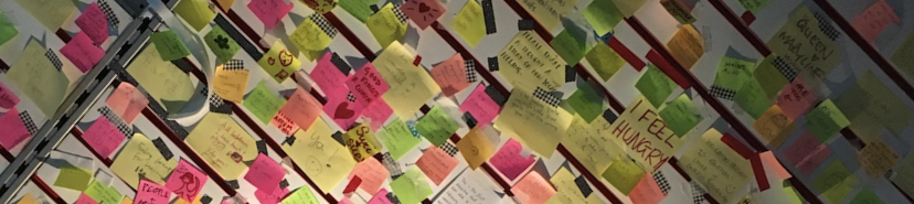 many post-it notes on a wall